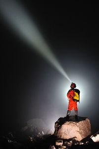 Full length of woman standing on rock