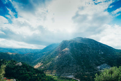 Picturesque landscape with mountains, cloudy sky and valley in argiroupolis on island crete, greece.