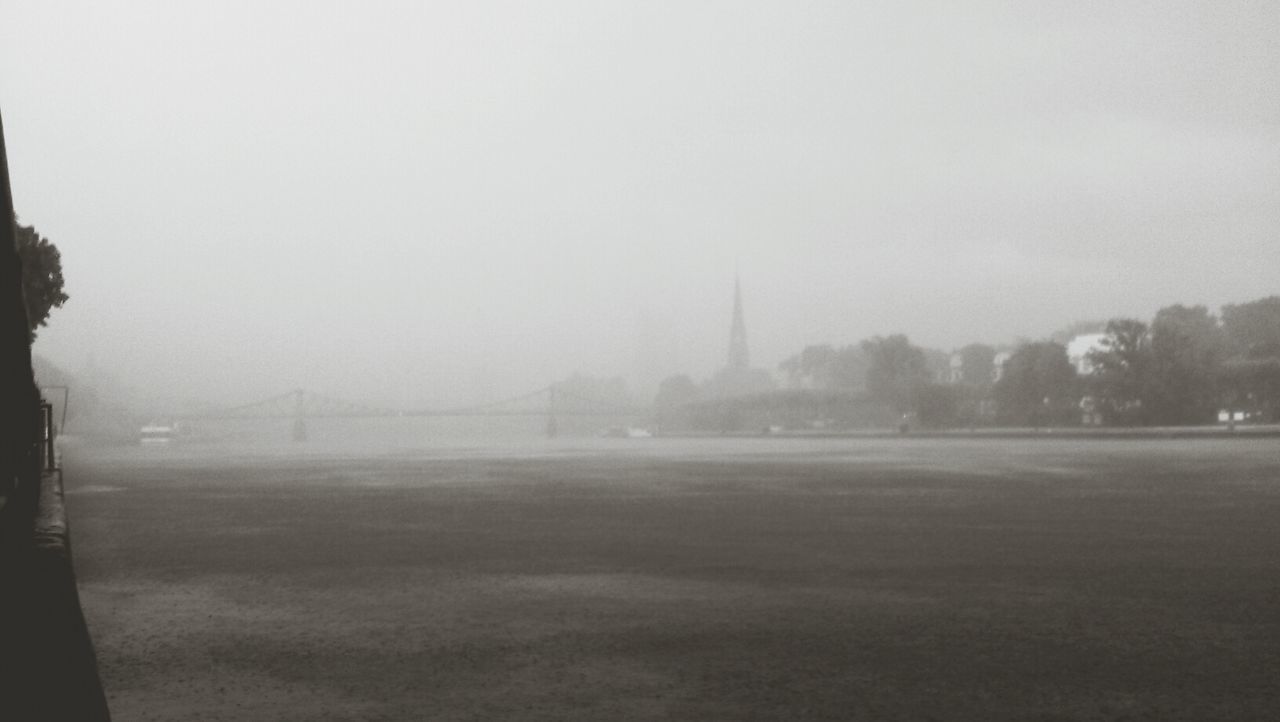 fog, foggy, built structure, architecture, copy space, weather, building exterior, city, sky, mist, water, nature, day, outdoors, landscape, river, tranquility, cityscape, no people