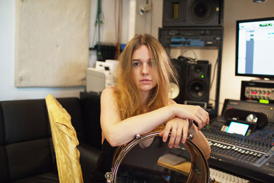 Young woman at a recording studio