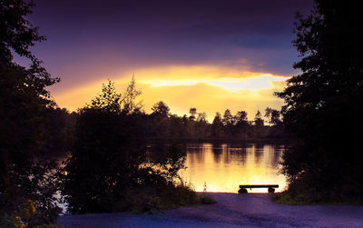 Scenic view of lake against sky during sunset