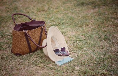 High angle view of shoes on sunglasses on field