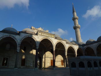 Low angle view of historical building against blue sky