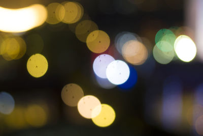 Defocused image of illuminated lights at night