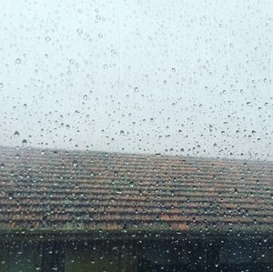 Buildings seen through wet window