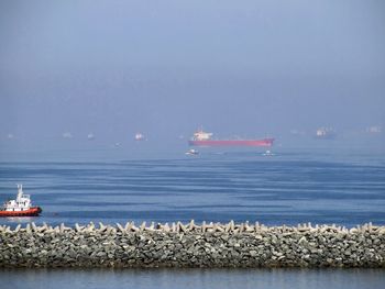 Scenic view of bay against sky