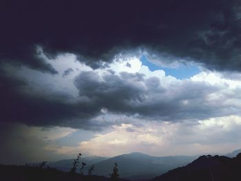 Scenic view of silhouette mountain against sky during sunset