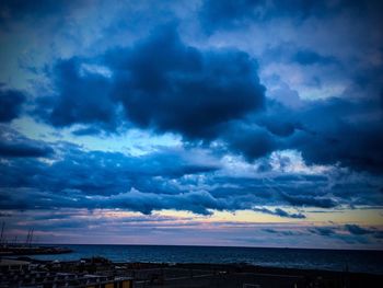 Scenic view of sea against dramatic sky