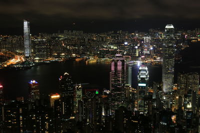 Aerial view of illuminated city buildings at night