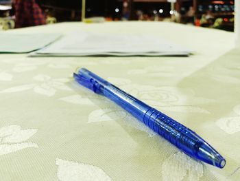 Close-up of blue paint on table