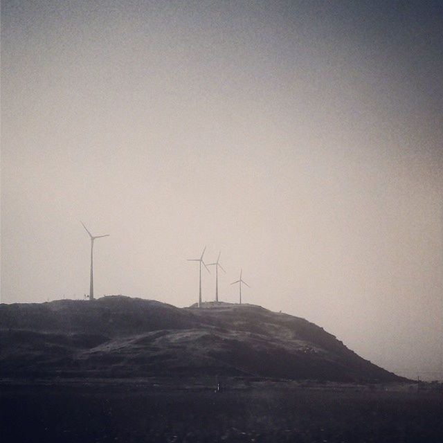 wind power, wind turbine, alternative energy, fuel and power generation, windmill, renewable energy, environmental conservation, landscape, technology, field, copy space, tranquil scene, tranquility, clear sky, rural scene, traditional windmill, nature, scenics, electricity pylon, sky