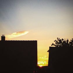 Silhouette of built structures at sunset