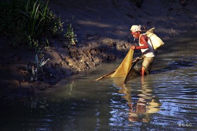 Man surfing in river