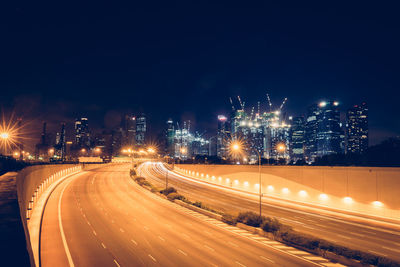 Light trails on curved road at night