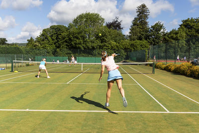 Mature women during a tennis match on grass court