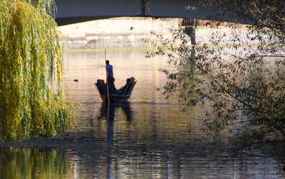 Man sitting on riverbank