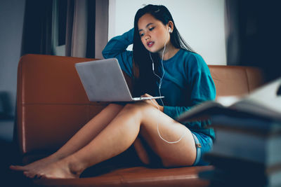 Young woman using mobile phone