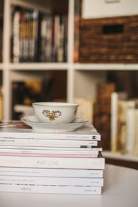 Close-up of open book on table at home