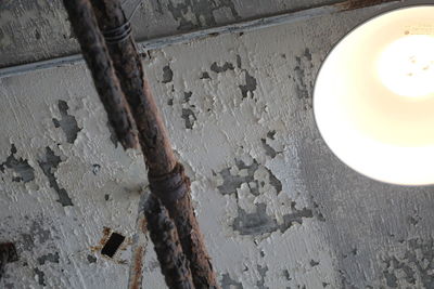 High angle view of illuminated lamp on wall