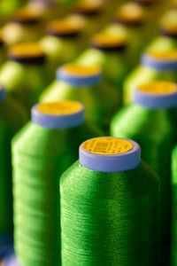 Close-up of green spools