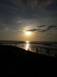 Scenic view of beach against sky during sunset