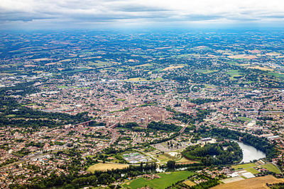 Aerial view of cityscape against sky