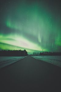 Road against sky at night