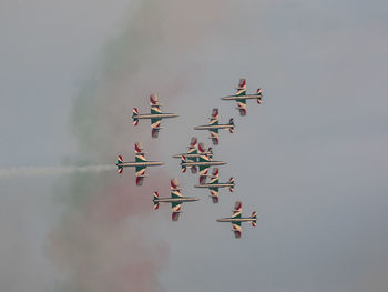 Low angle view of airshow in sky