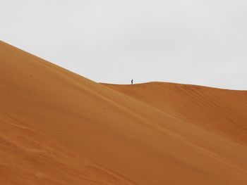 Scenic view of desert against clear sky