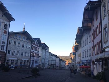 Surface level view of old town against clear blue sky