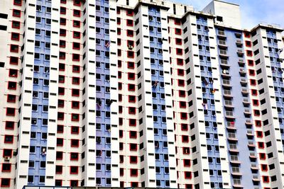 Low angle view of modern building in city against sky