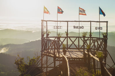 Lifeguard hut on mountains against sky