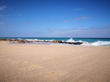 Scenic view of beach against sky