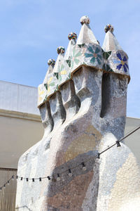 Low angle view of statue against sky