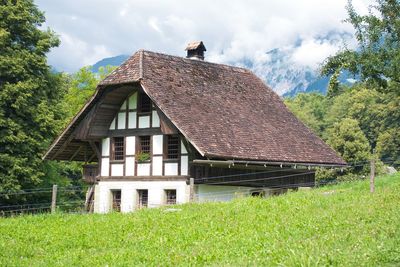 House on field against sky