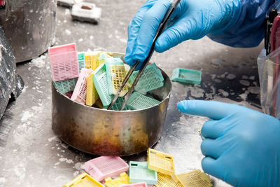 Cropped hand of man preparing food