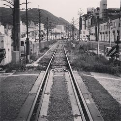 Railway tracks along buildings