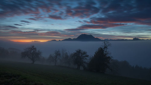 Scenic view of landscape against sky during sunset