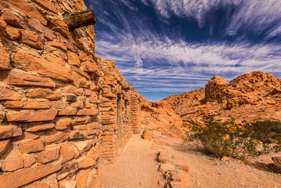 View of desert against cloudy sky