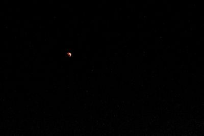 Low angle view of moon in sky at night