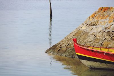 Boat moored on lake