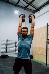 Male athlete exercising in gym