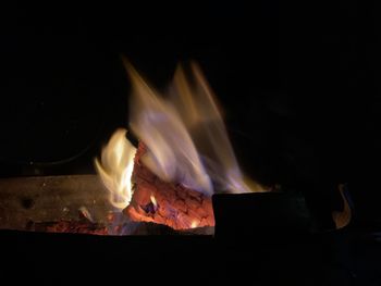 Close-up of burning fire in the dark