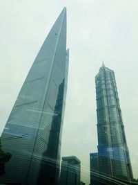 Low angle view of modern buildings against sky