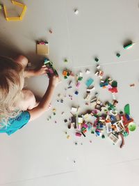 High angle view of girl playing with toys