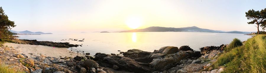 Panoramic view of sea against sky during sunset