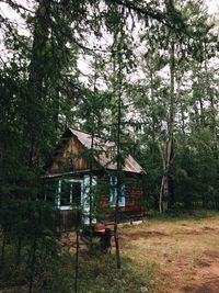 Built structure in forest against sky