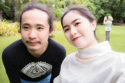 Portrait of young couple at park