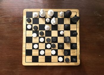 High angle view of chess pieces on table