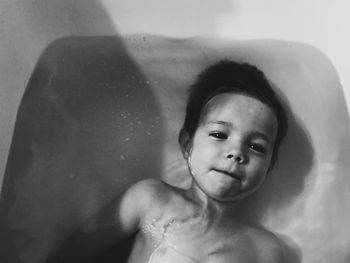 Portrait of boy in bathtub